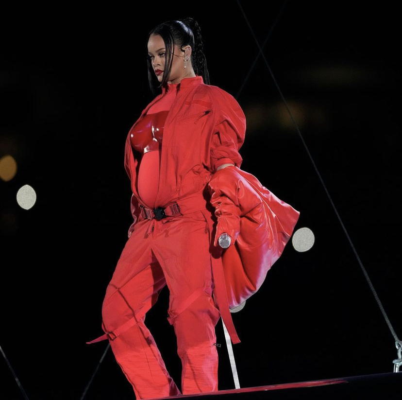 Rihanna makes a career comeback headlining the Super Bowl LVII halftime show, dubbed the "Fenty Bowl," and announces her second pregnancy. The singer is the second artist in Super Bowl history to lead the entire halftime performance without any feature artists to collaborate. Well, do we count Fenty Beauty's Invisamatte Blotting Powder compact?
 Apple Music, who sponsored this year's halftime show, fought to give the "Needed Me" singer 13 minutes, and it certainly paid off. Filled with dancers in Y2K aesthetic fur-hooded jackets and levitating platform, Rihanna was literally a diamond in the sky.