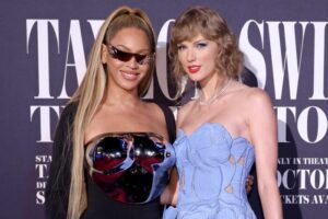 After moving up its premiere date, Taylor Swift glows next to Beyoncé at the Eras Tour film premiere at the Grove in Los Angeles.
