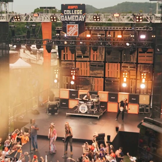 A still from the video for Lainey Wilson, Darius Rucker and The Cadillac Three's cover of "Comin' To Your City," recently announced as the new ESPN College GameDay theme.