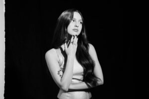 Olivia Rodrigo opens the soundtrack for The "Hunger Games: The Ballad of Songbirds & Snakes" with the new single 'Can't Catch Me Now.'