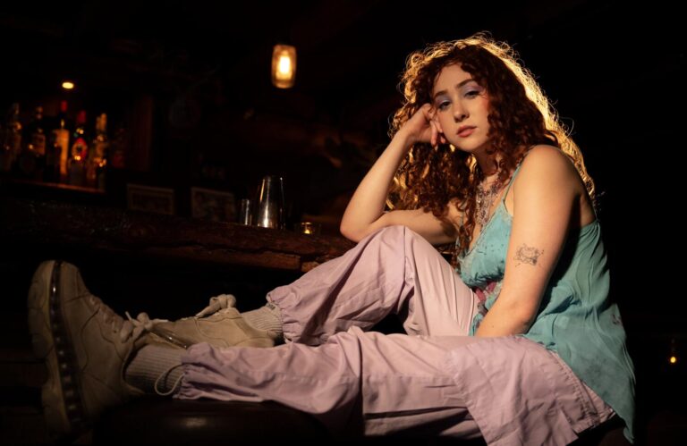 LOS ANGELES, CA - AUGUST 14, 2023: Chappell Roan sits on a barstool at the Big Foot Lodge on August 14, 2023 in Los Angeles, CA. Her new album 'The Rise and Fall of a Midwest Princess' is coming out in September.(Gina Ferazzi / Los Angeles Times)